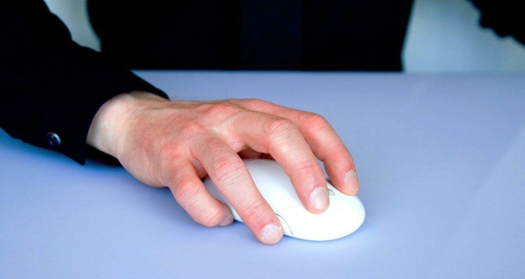 Man controlling computer mouse