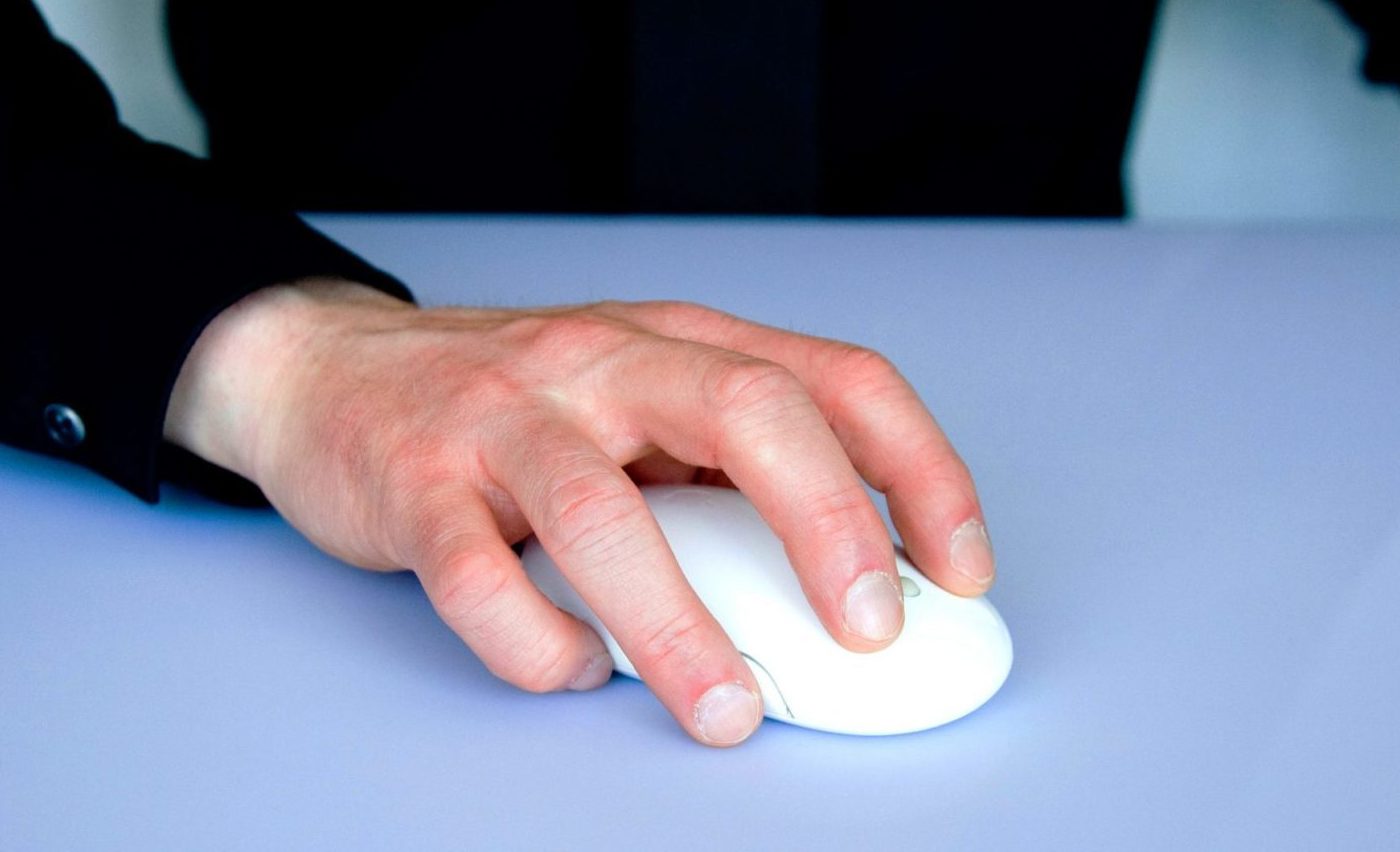 Man controlling computer mouse