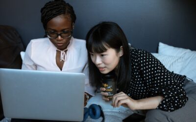 ICO for e-commerce - two women looking at a laptop